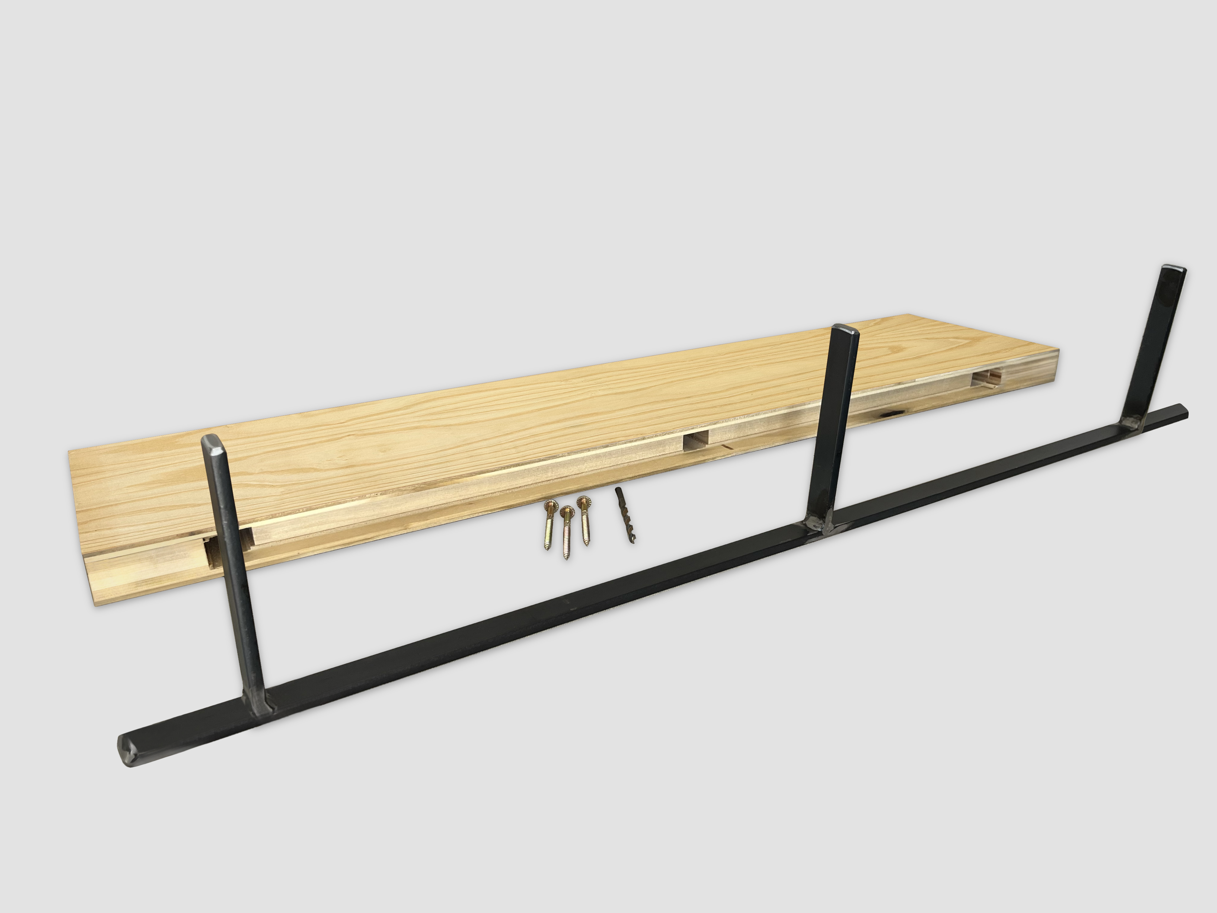 Ash wood floating shelf back edge with black metal bracket on a white background