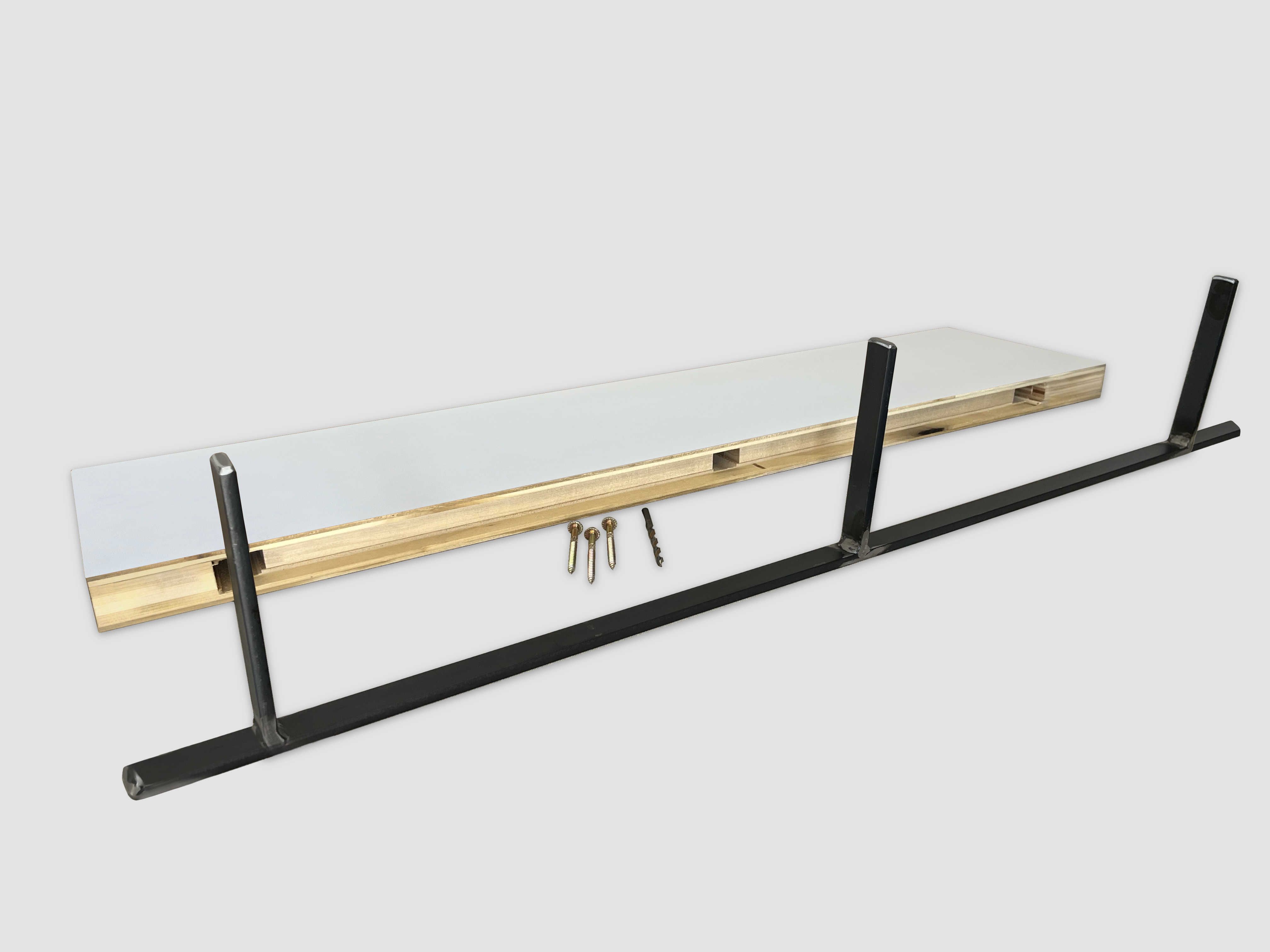 White floating shelf back edge with metal bracket on a white background