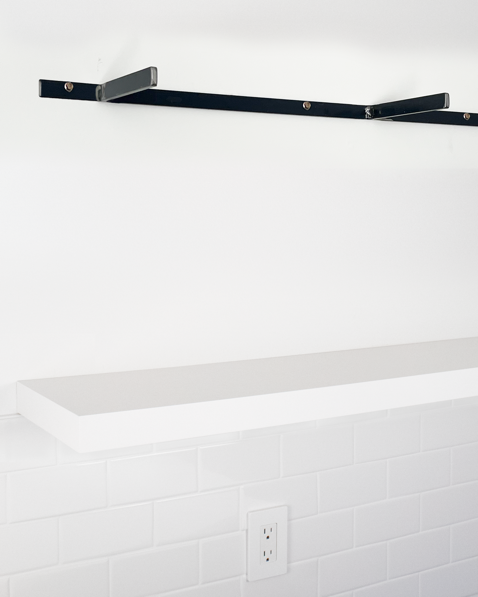 White floating shelf 1.75 inch thick angle view installed steel HW top