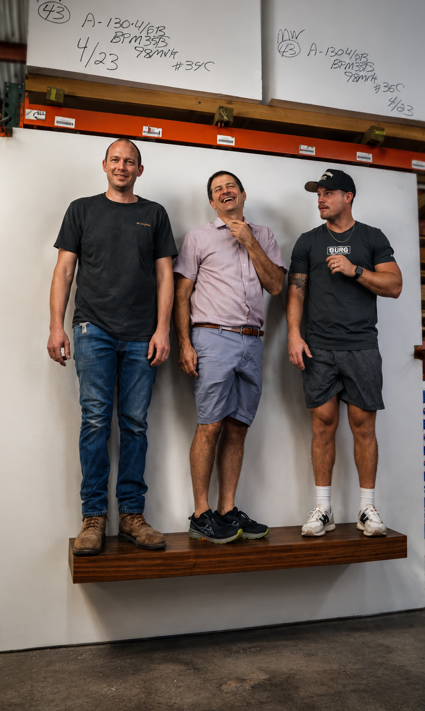 floating shelf with 3 men standing on the shelf