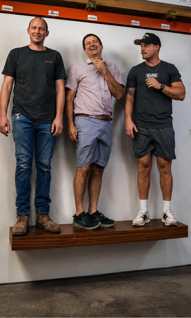 floating shelf with 3 men standing on the shelf