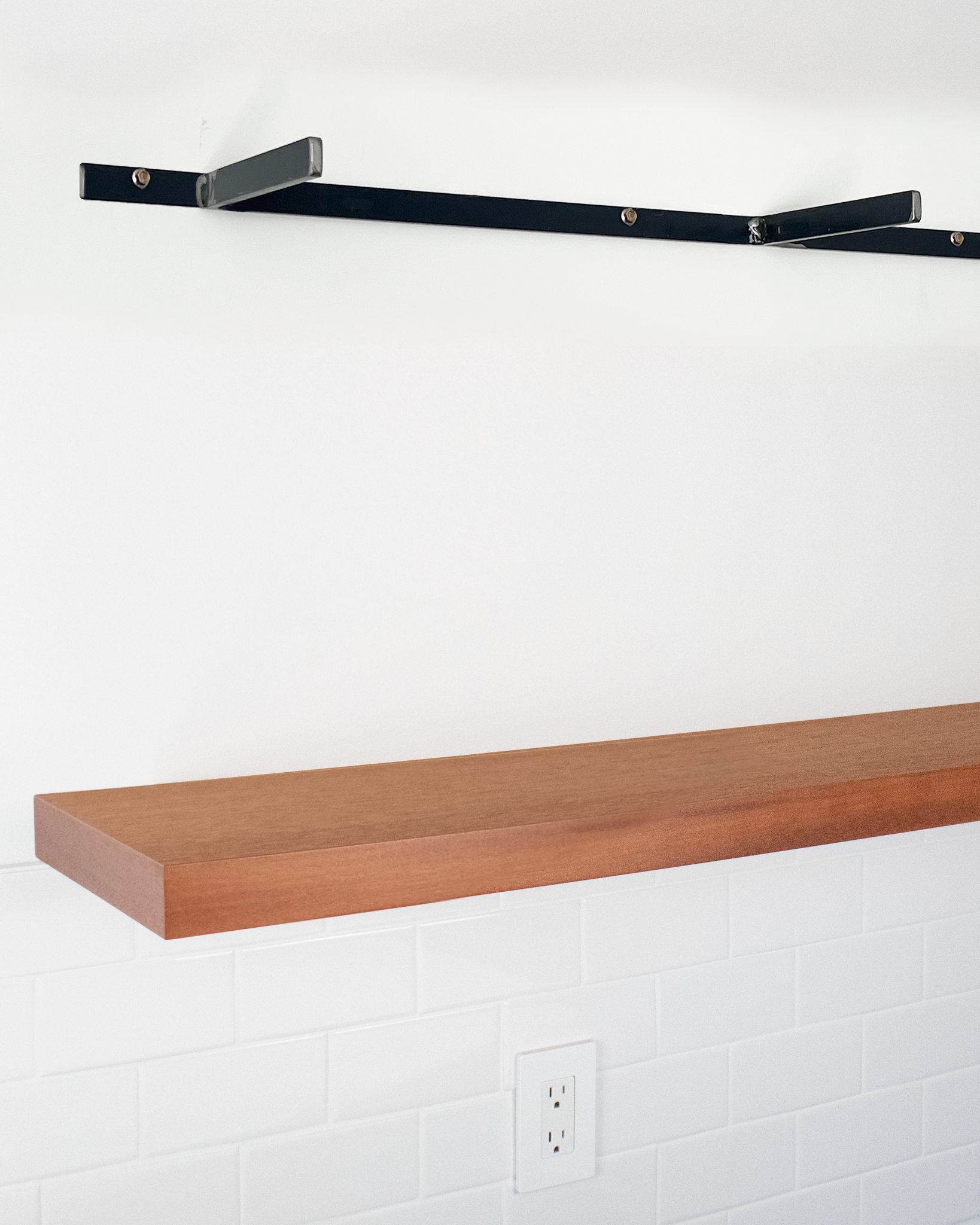 African Mahogany floating shelf 1.75 inch thick angle view installed steel HW top