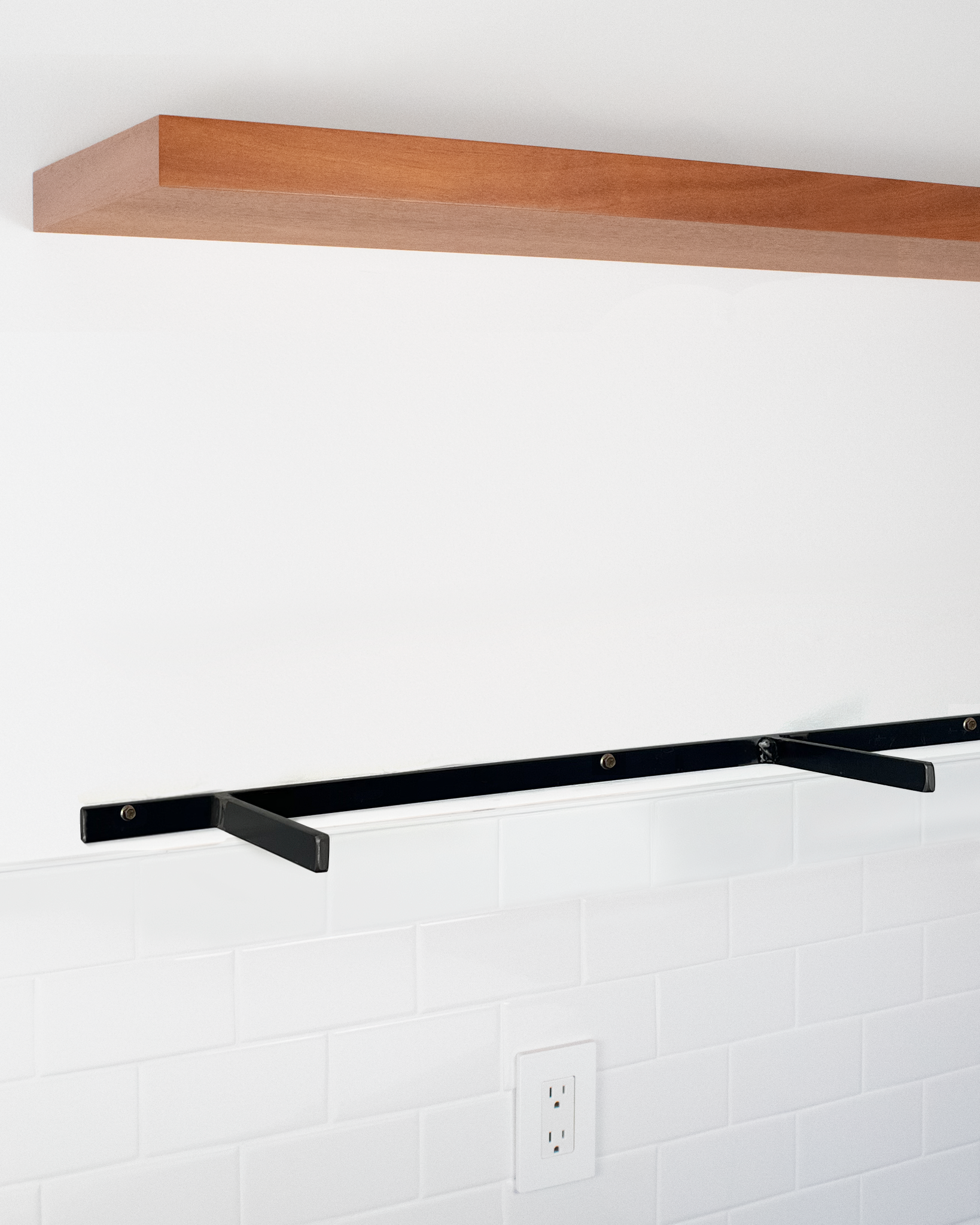 African mahogany floating shelf 1.75 inch thick angle view installed steel HW