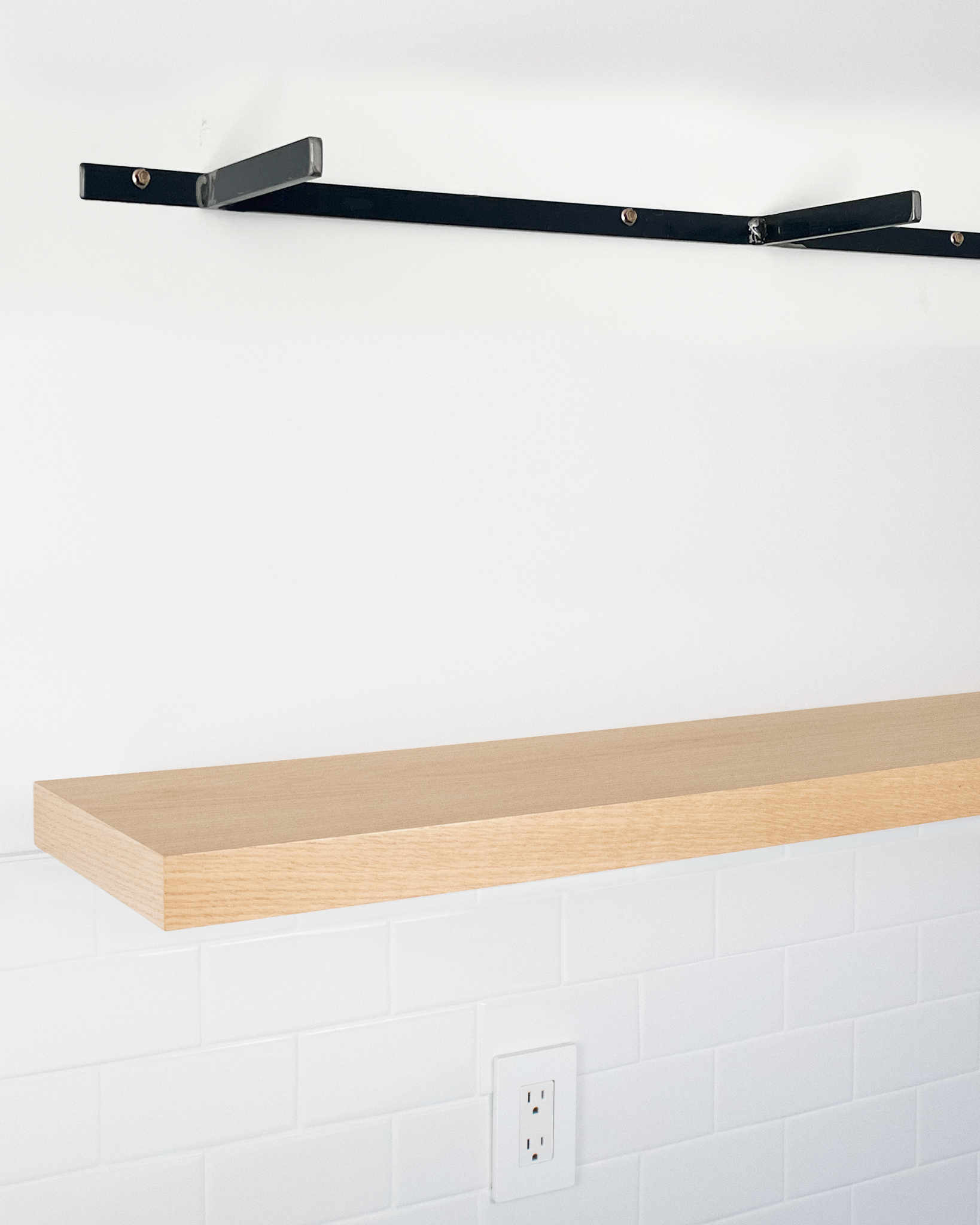 Bleached oak floating shelf 1.75 inch thick angle view installed steel HW top