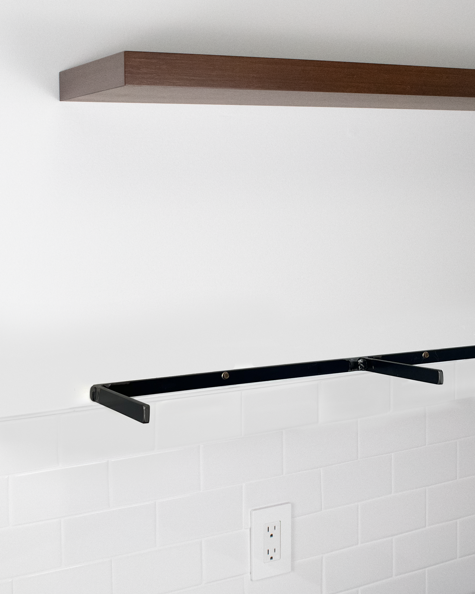 floating shelf in chocolate bamboo with ubermachtiig hardware mounted to wall