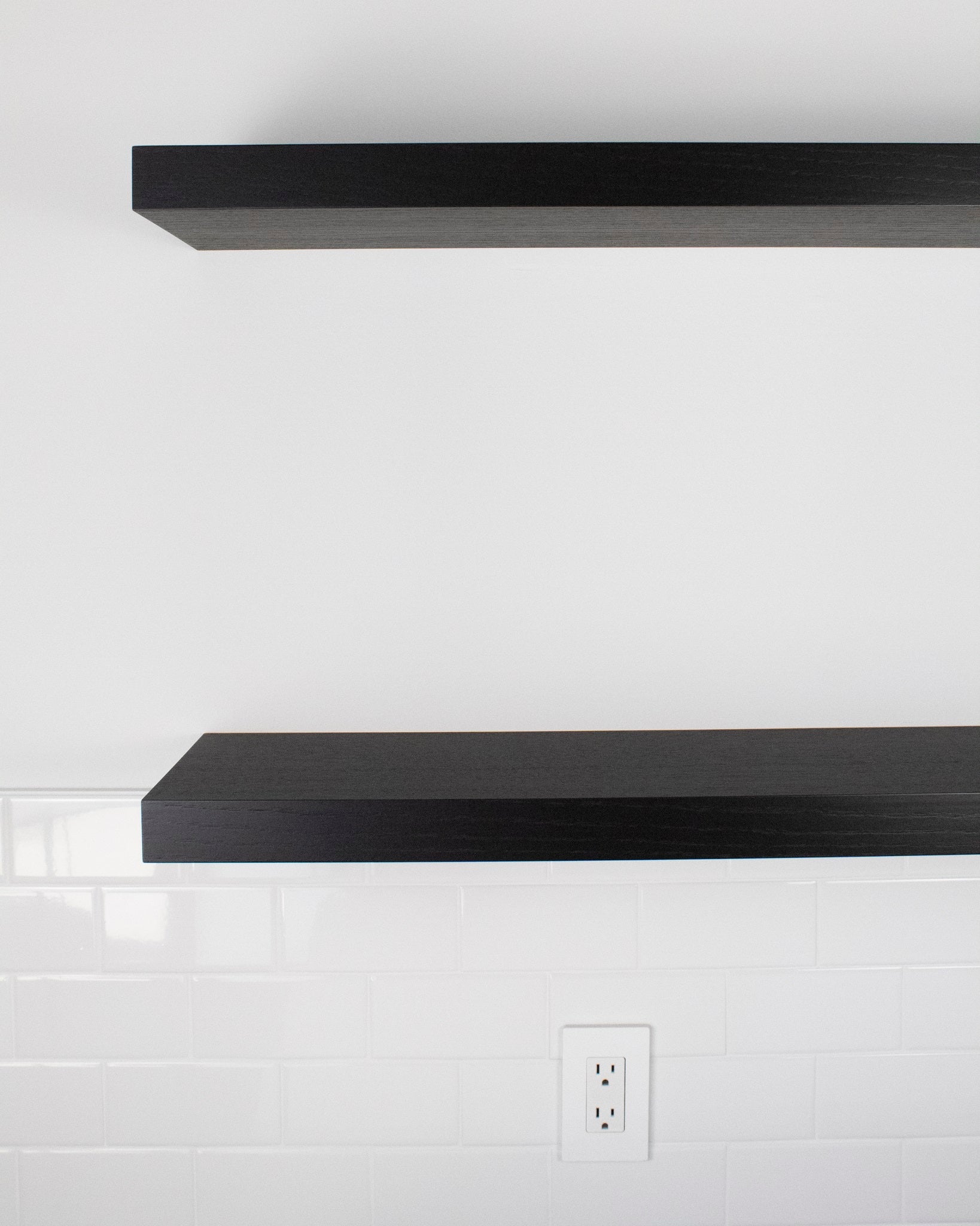 Front view of chocolate espresso oak floating shelves