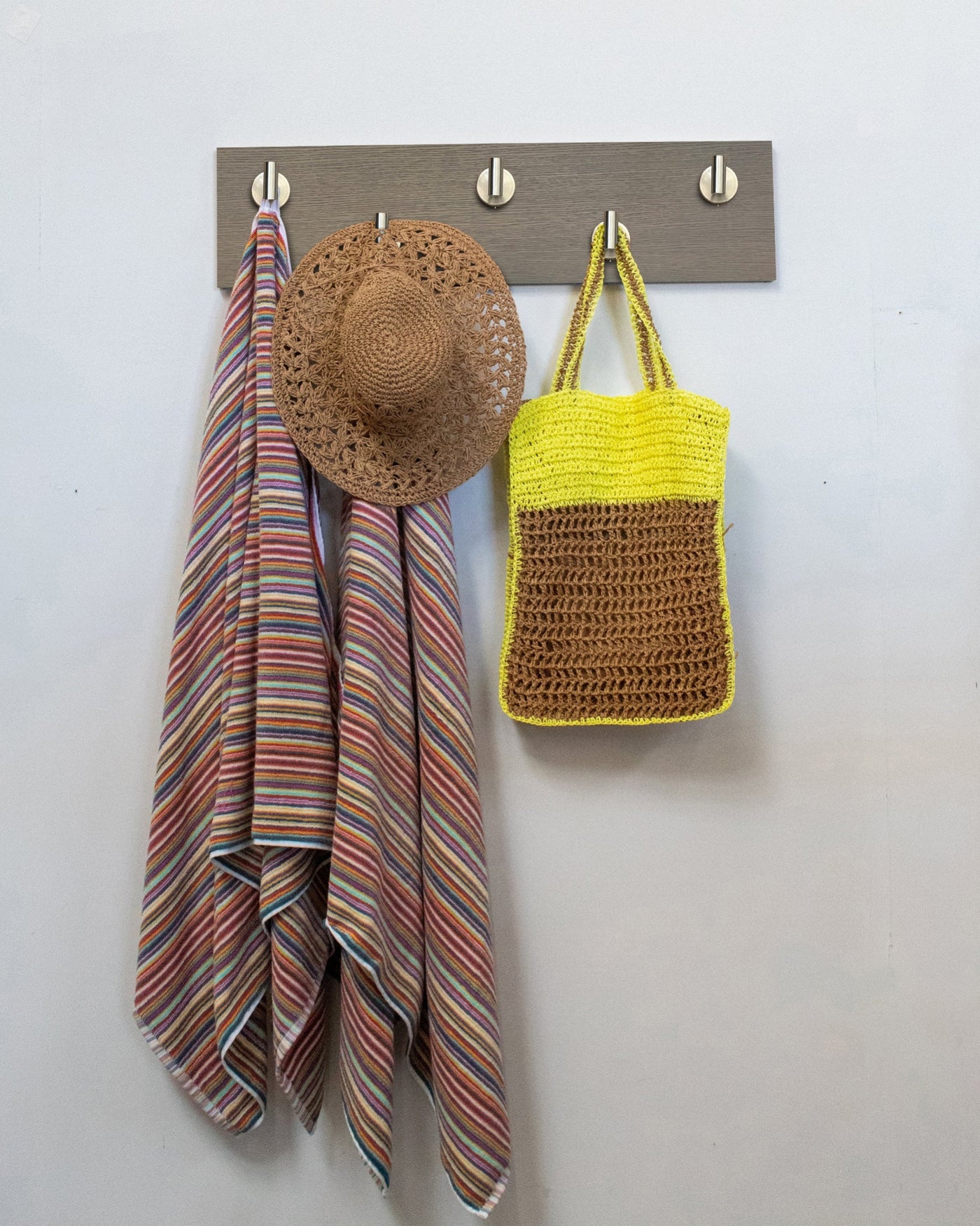 Driftwood Grey Oak wall hook rack with 5 satin nickel hooks, striped towel, straw hat, and yellow bag