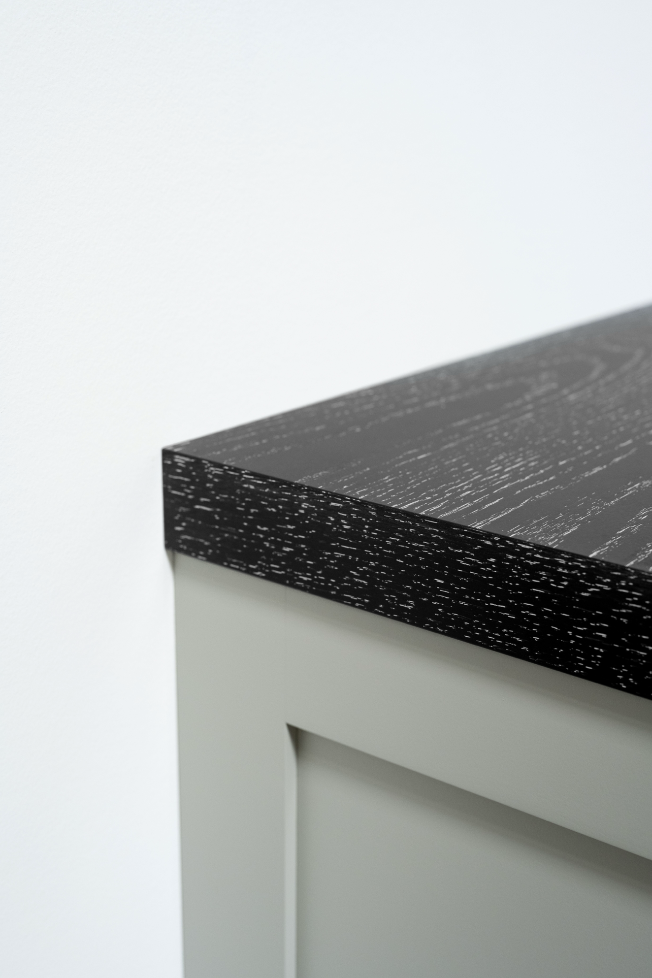 Ebonized cerused oak cabinet top corner edge