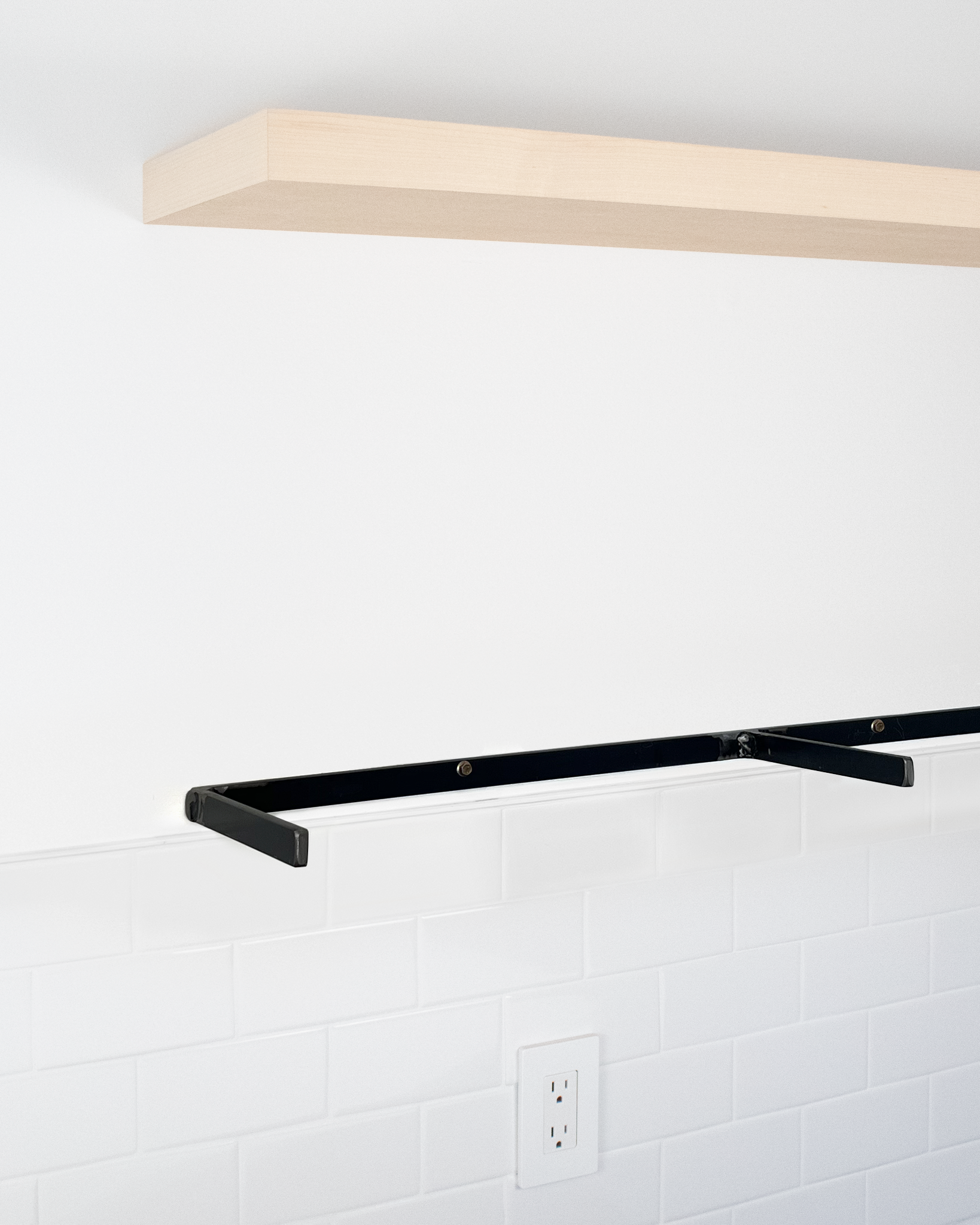 MDF floating shelf with exposed metal bracket