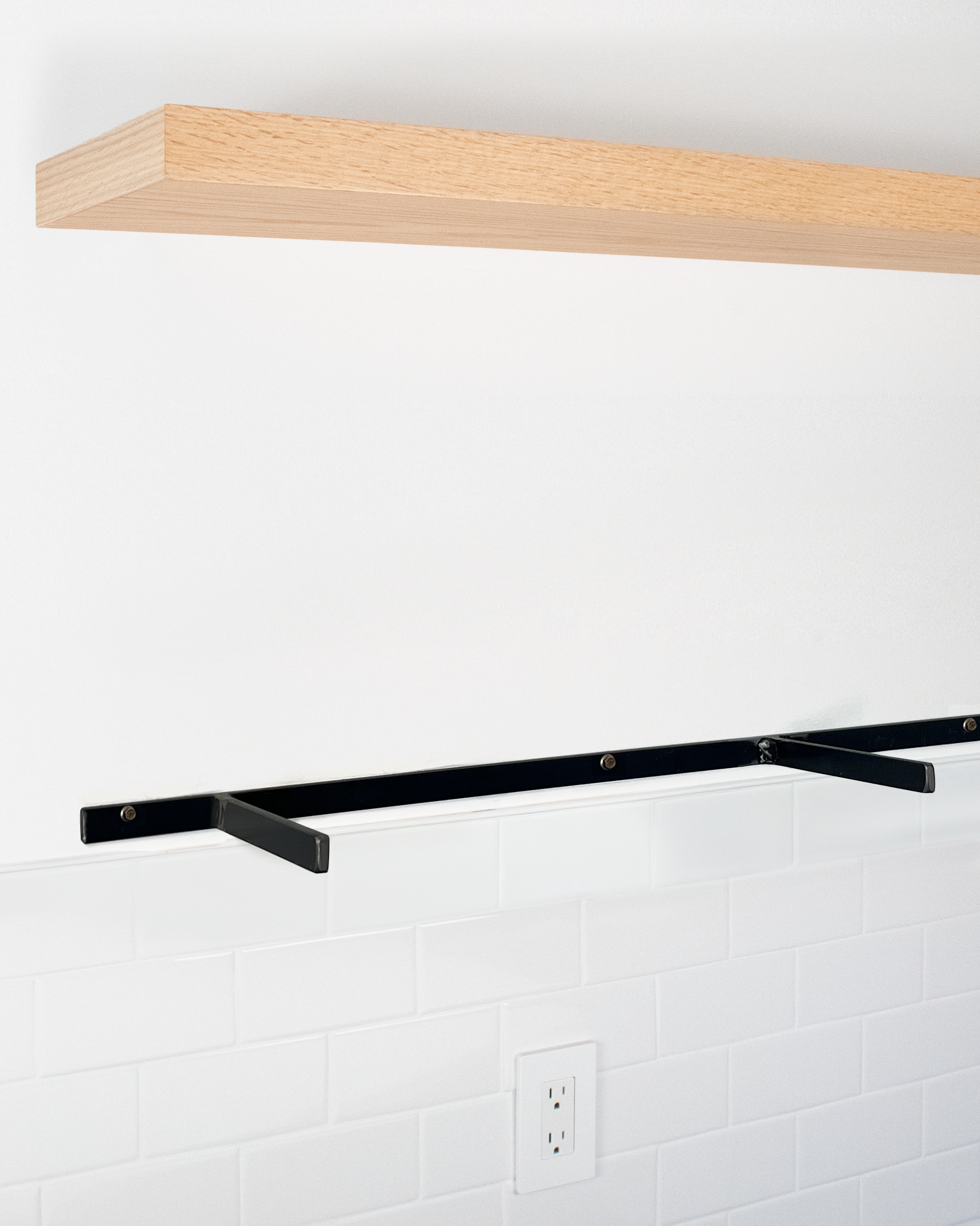 Red oak floating shelf 1.75 inch thick angle view installed steel HW