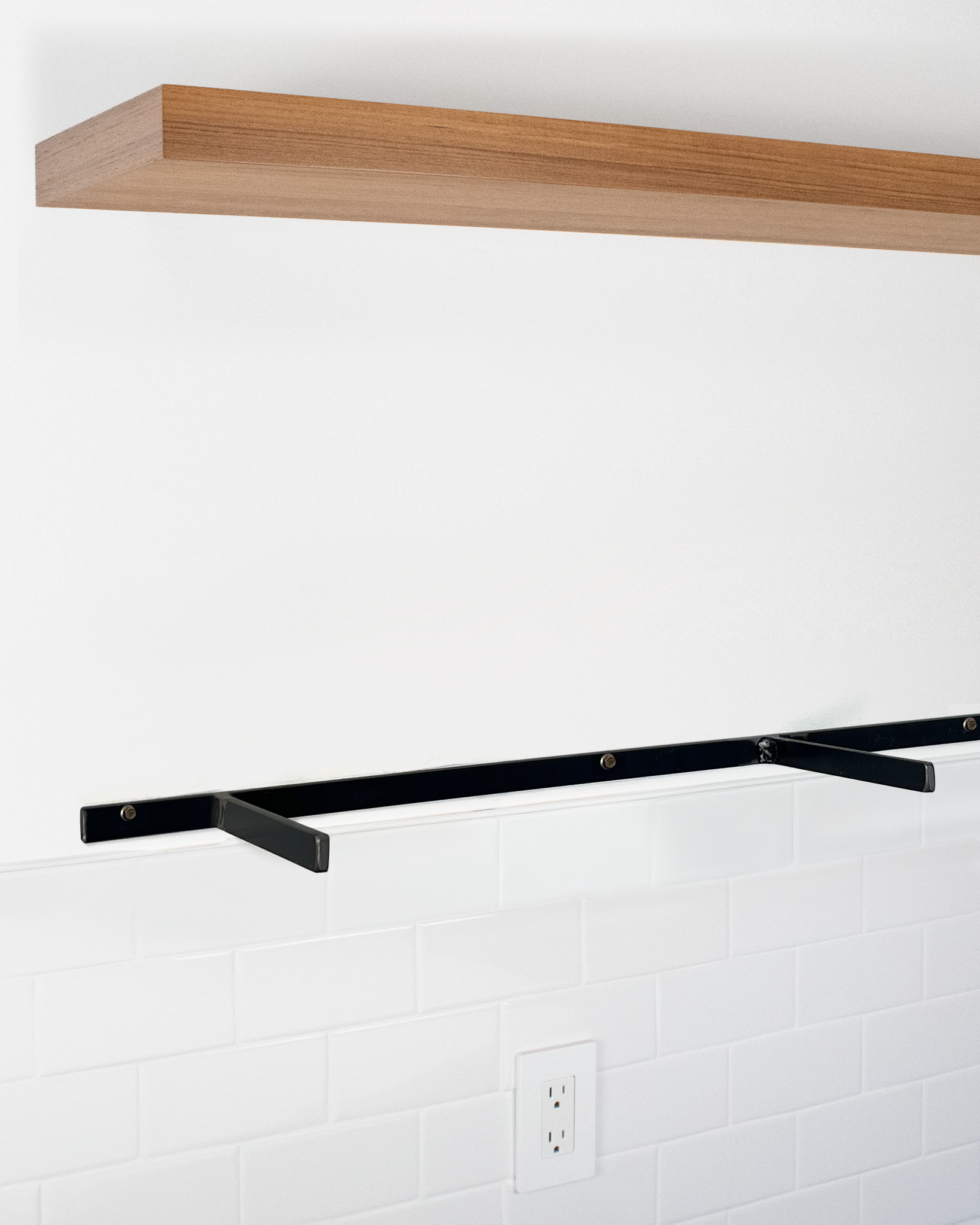 Teak floating shelf 1.75 inch thick angle view installed steel HW