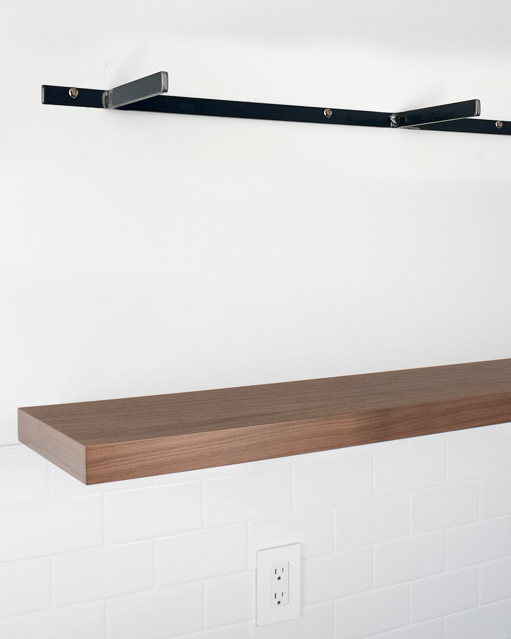 Walnut floating shelf 1.75 inch thick angle view installed steel HW top