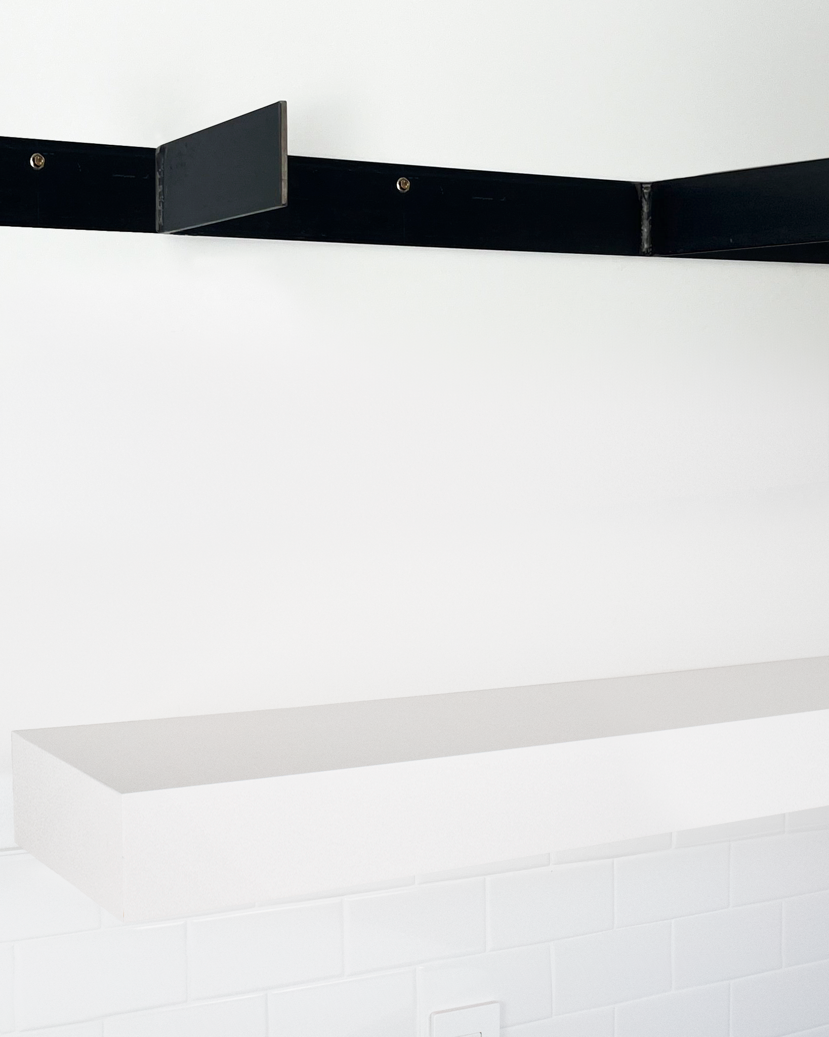 White floating shelf 4 inch thick angle view installed steel HW top