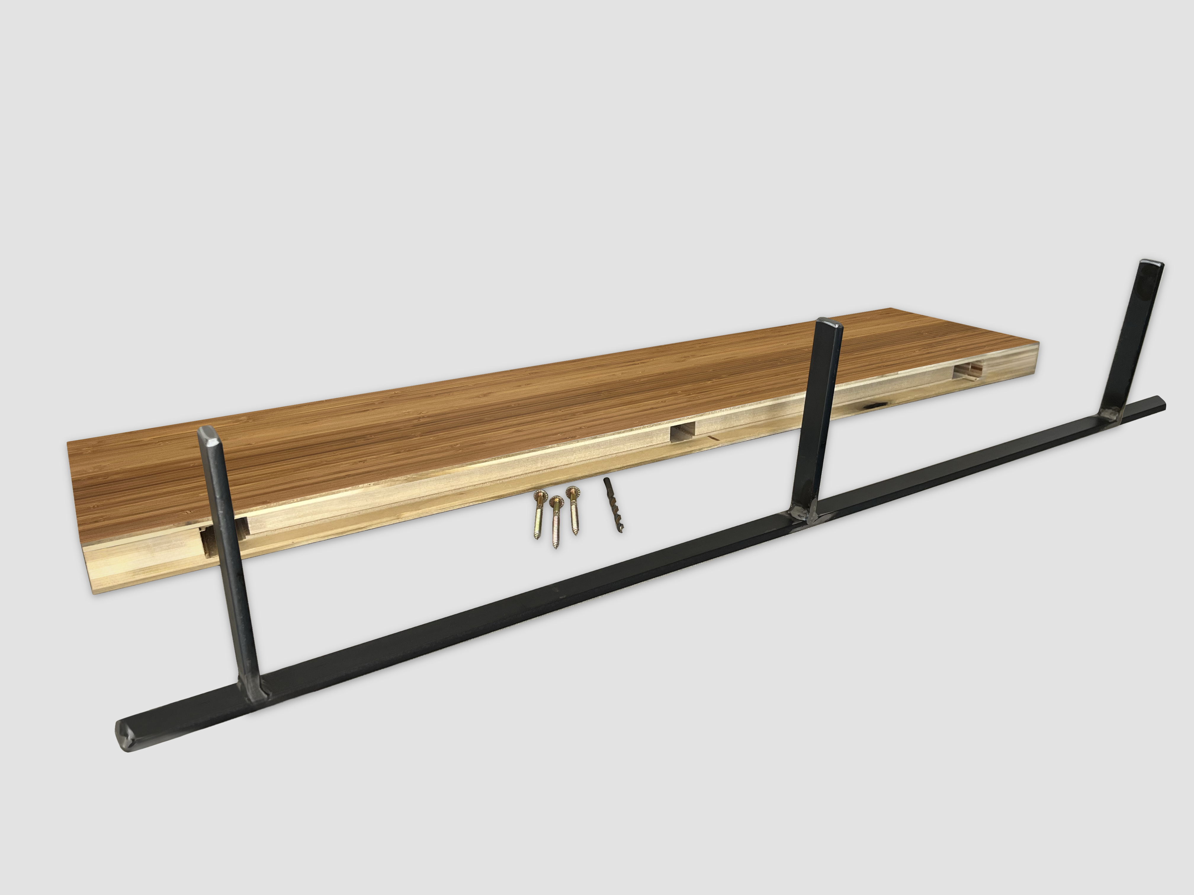 Bamboo floating shelf back edge with black metal bracket on a white background