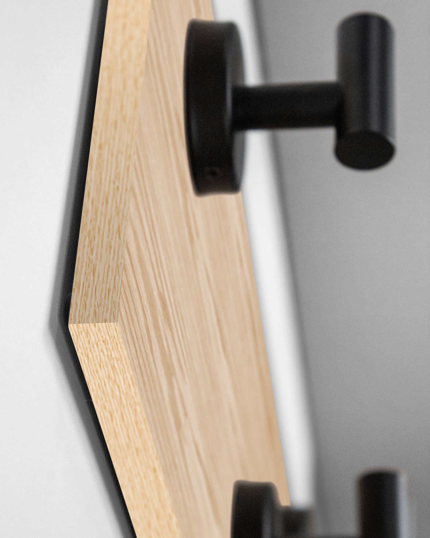 edge detail close up of Red Oak Wood wall hook rack matte black hooks