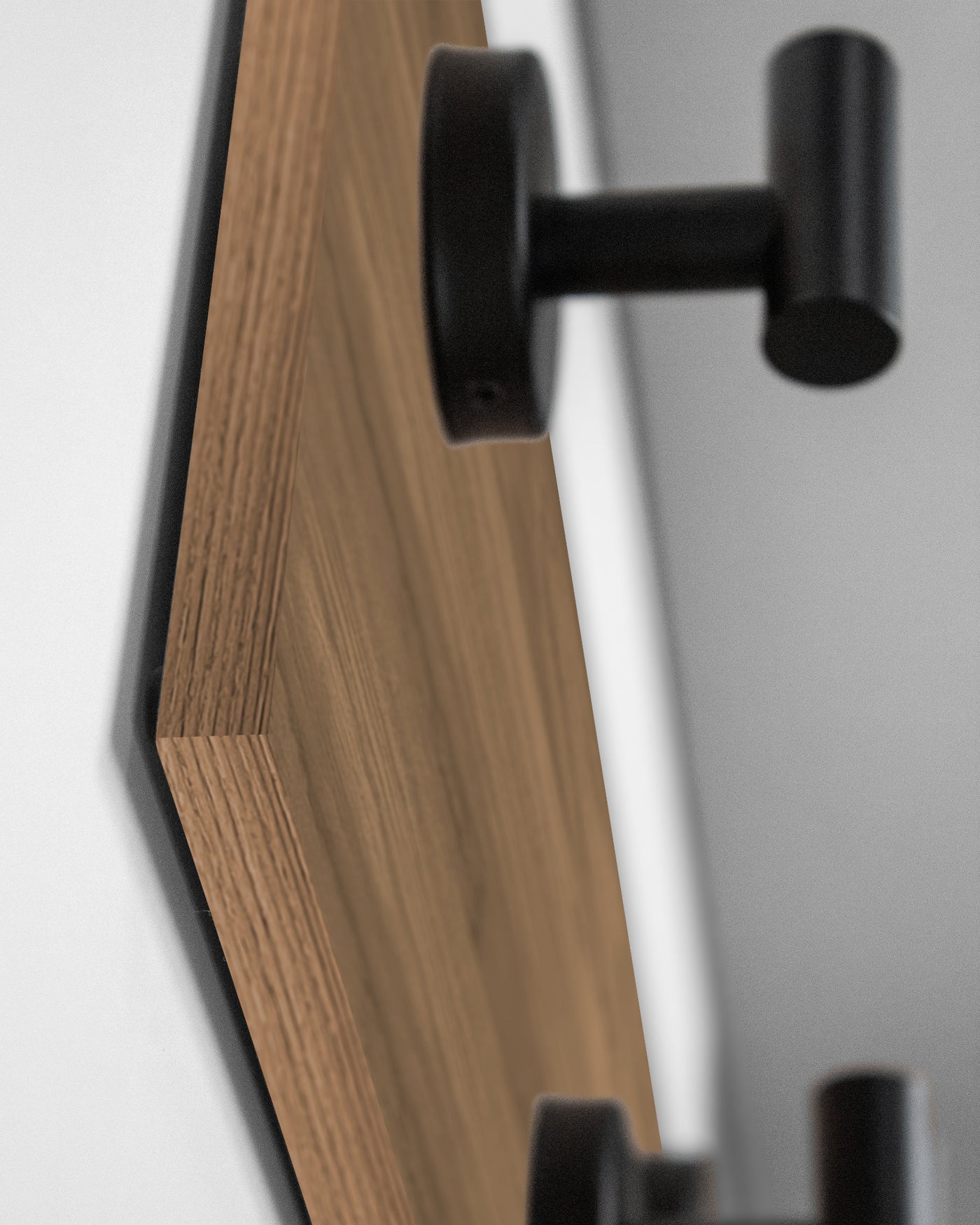 edge detail close up of cherry Teak wall hook rack matte black hooks