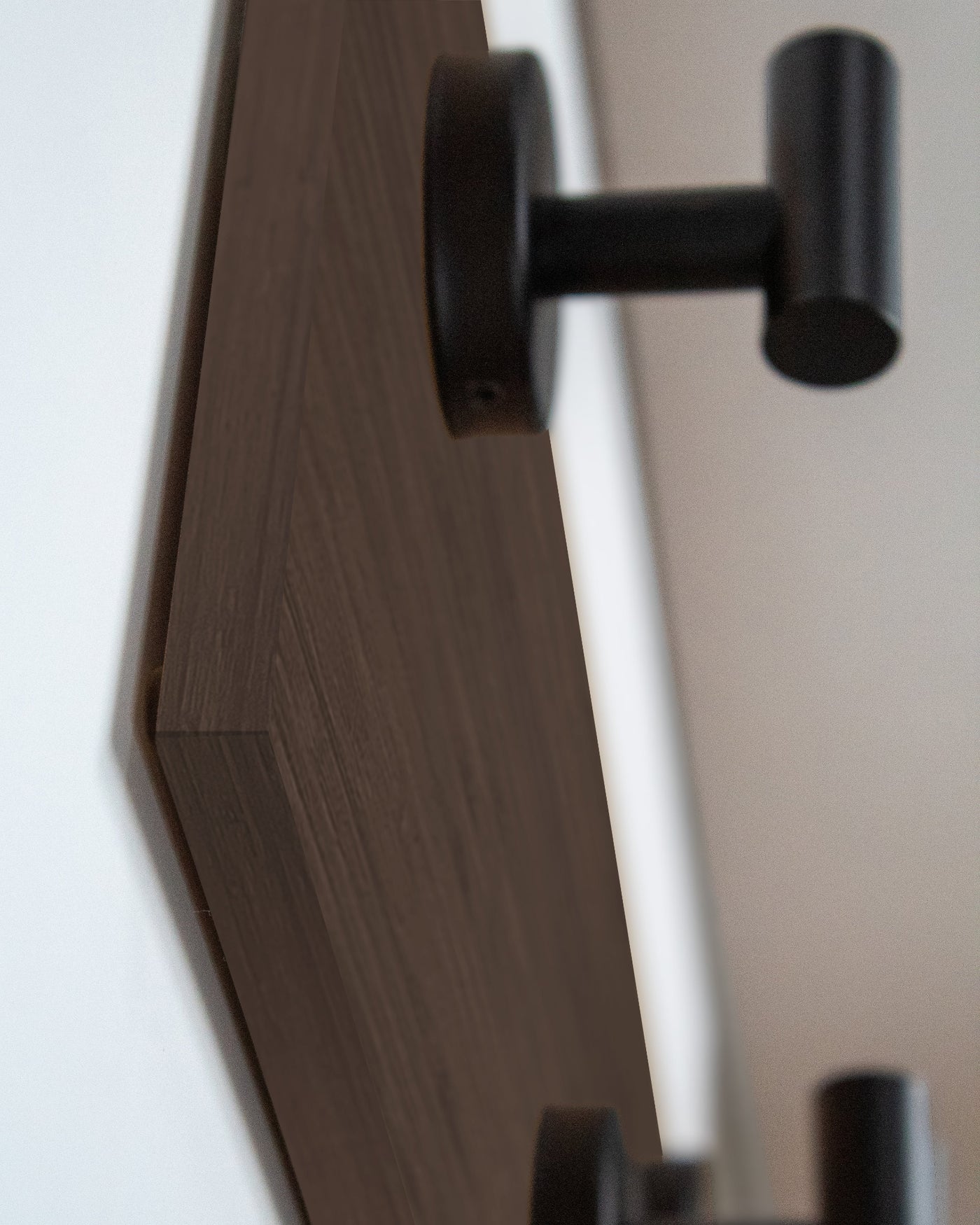 edge detail close up of chocolate bamboo Wood wall hook rack matte black hooks
