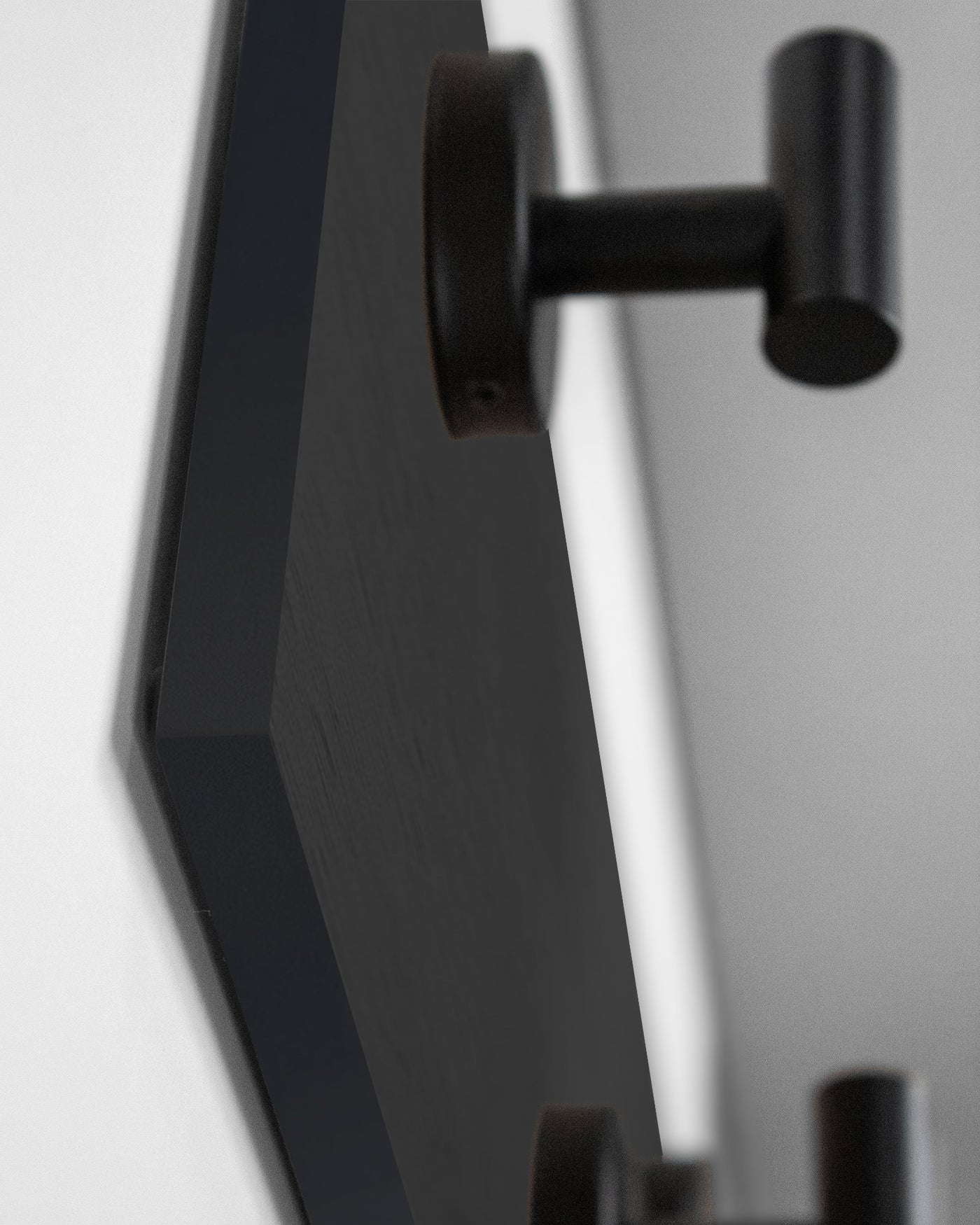 edge detail close up of chocolate espresso oak wall hook rack matte black hooks