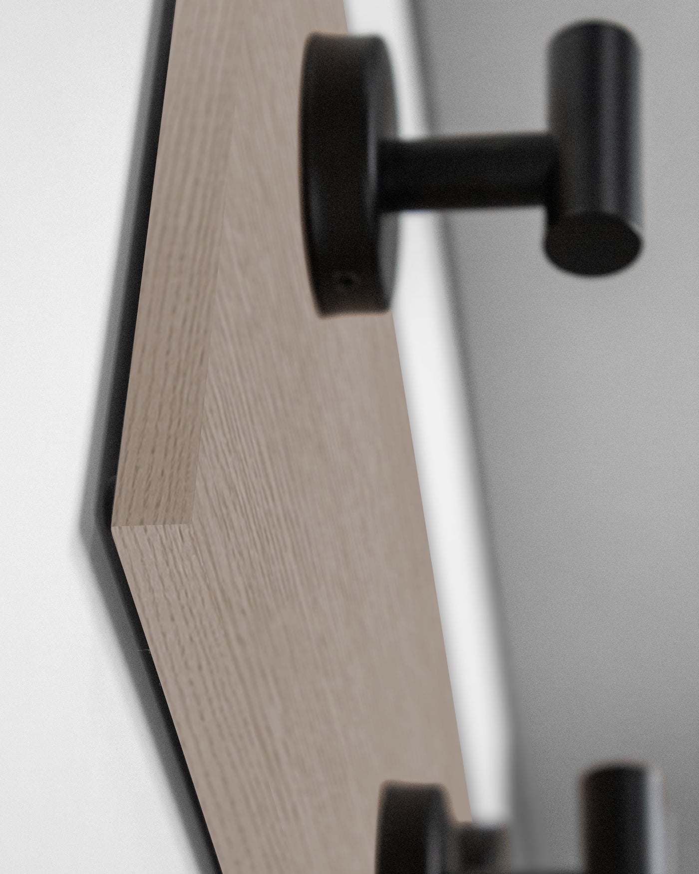 edge detail close up of driftwood grey oak wall hook rack matte black hooks