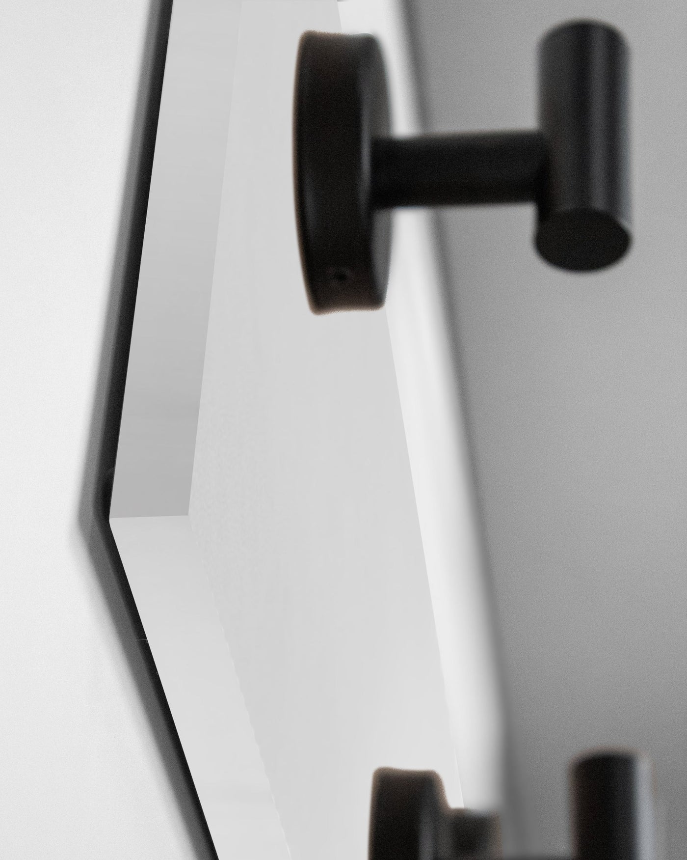 edge detail close up of white Wood wall hook rack matte black hooks